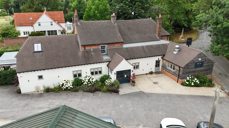 Aerial drone view of the pub set in the village