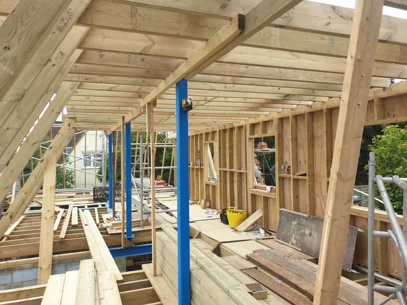 Carpenters on the timber roof frame
