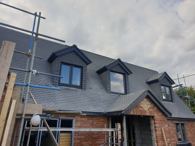 Dormers and slate roof during the build