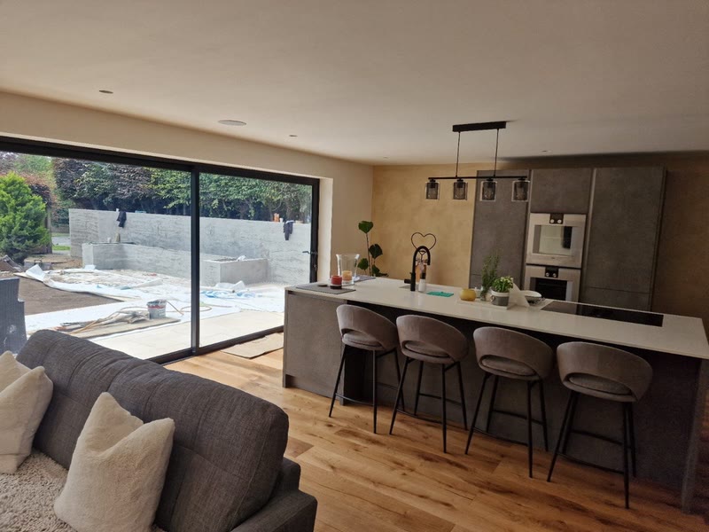 Kitchen island with bar stools and pendant lights