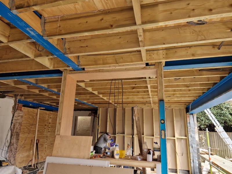 Vaulted timber roof structure being framed